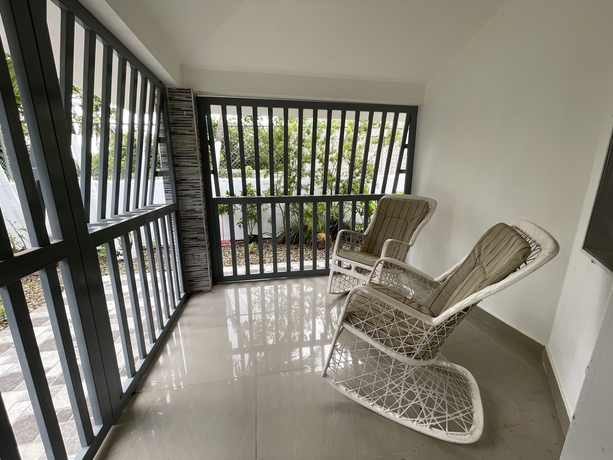 The screened porch, with two loungers