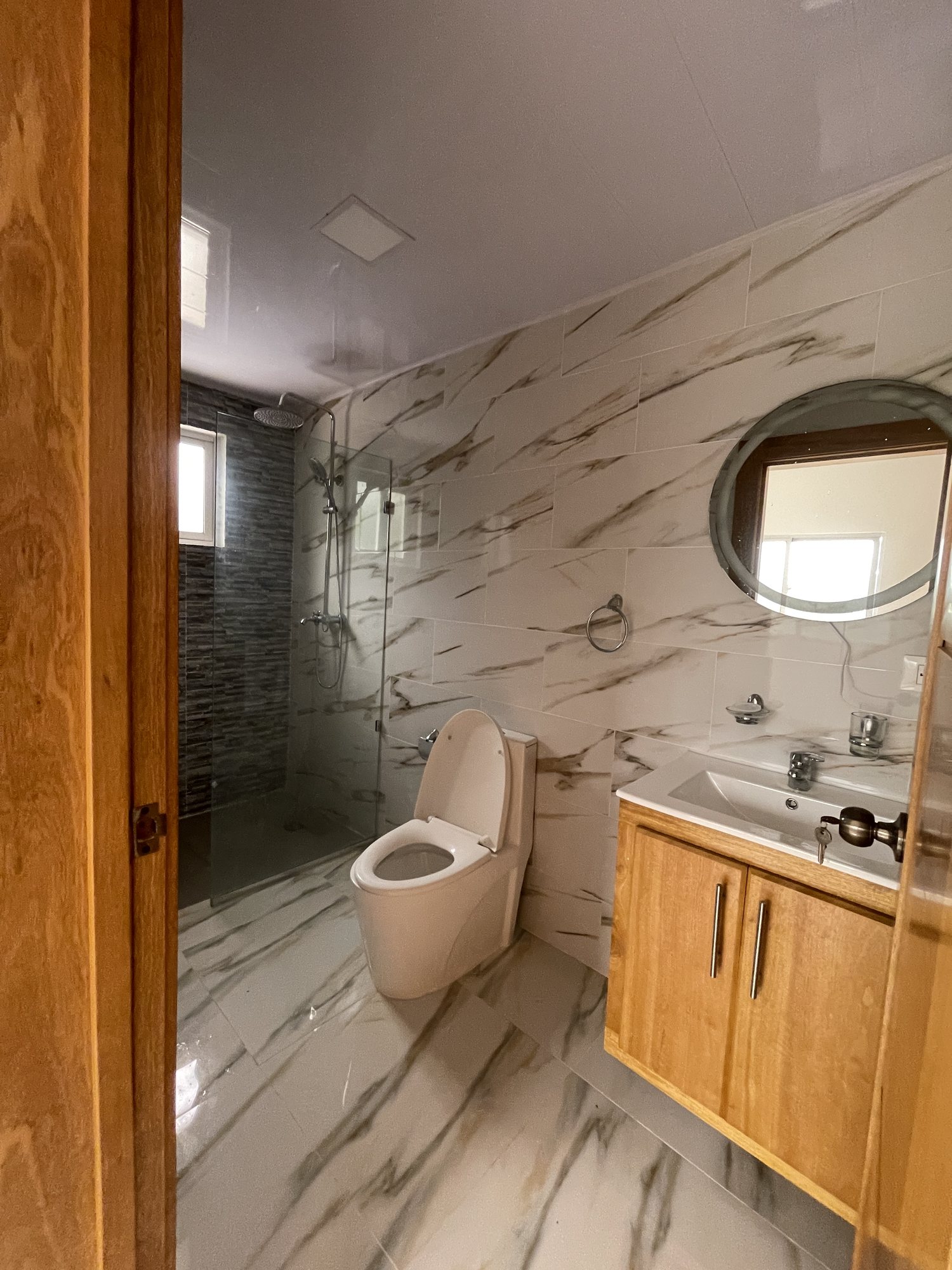 A full bathroom with a walk-in shower