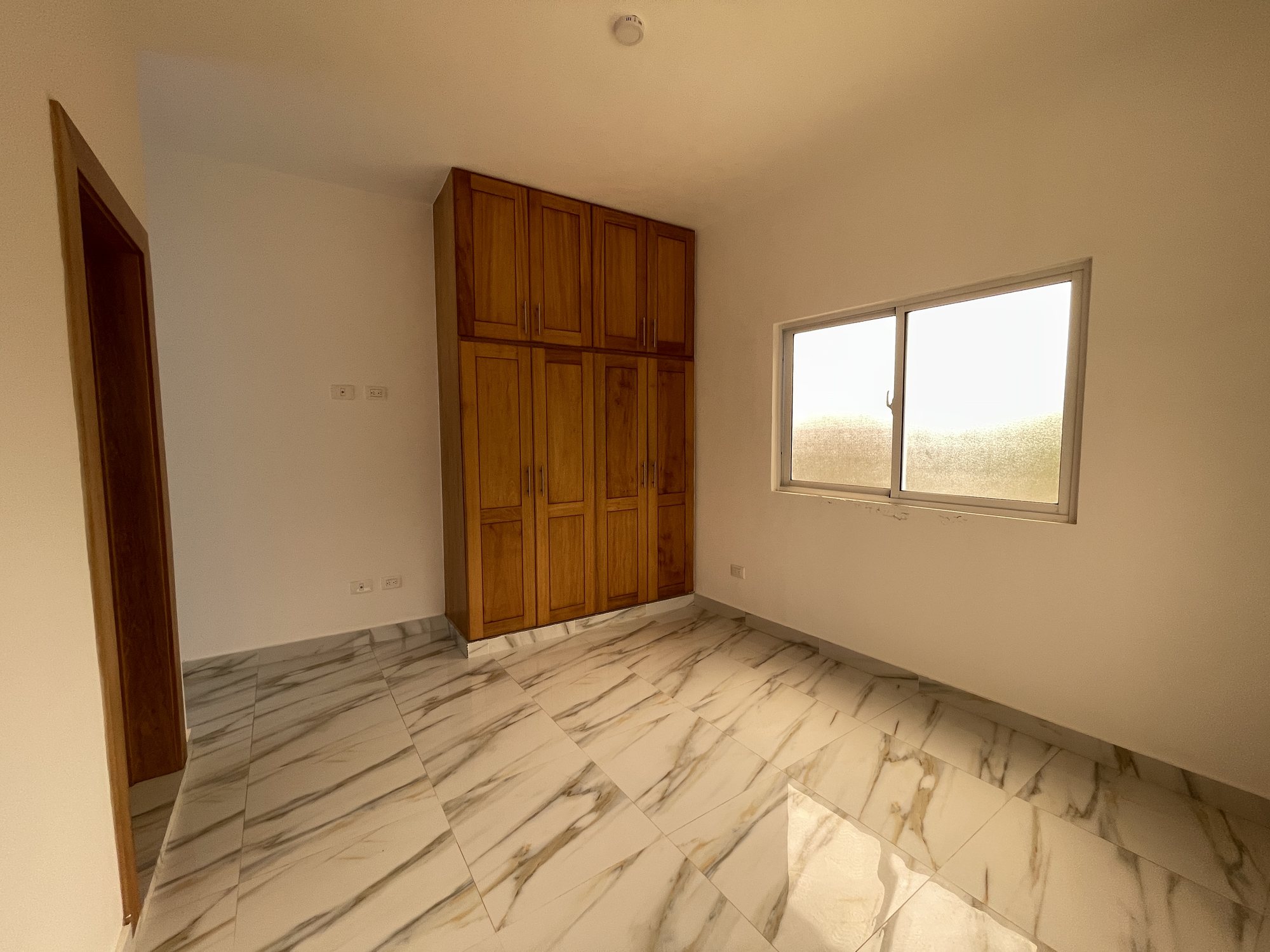 The second bedroom, with fitted wardrobes